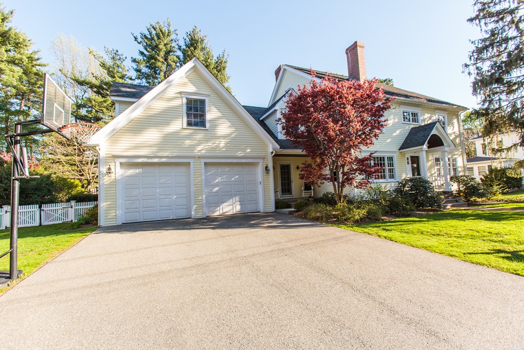 18 Thomas Road Wellesley, MA 02482 - Photo 24 of 24 a front view of a house with a yard and garage