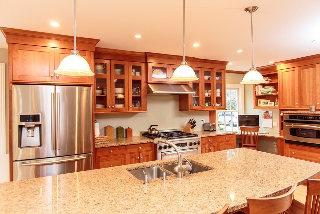 18 Thomas Road Wellesley, MA 02482 - Photo 6 of 24 a kitchen with stainless steel appliances granite countertop a sink refrigerator and cabinets