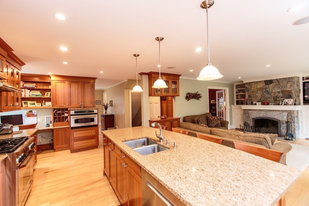 18 Thomas Road Wellesley, MA 02482 - Photo 10 of 24 a kitchen with stainless steel appliances granite countertop a sink a stove and a refrigerator