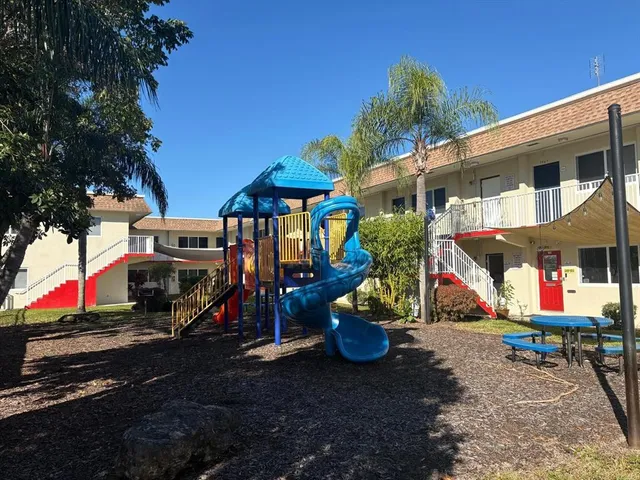 a view of a parked cars in front of a house