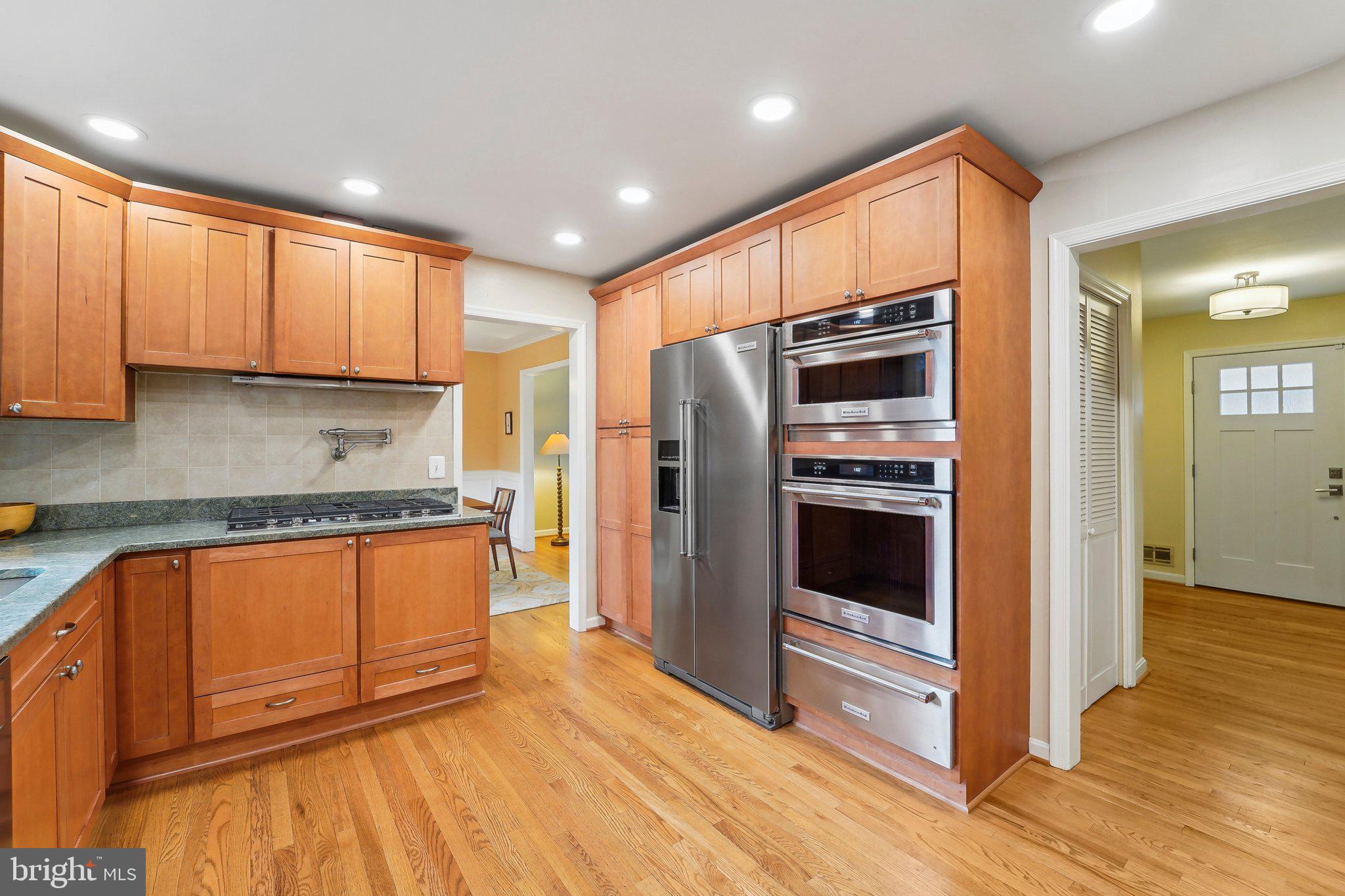 3 Emerson Road Severna Park, MD 21146 - Photo 12 of 65 a kitchen with stainless steel appliances granite countertop a refrigerator a sink and a stove