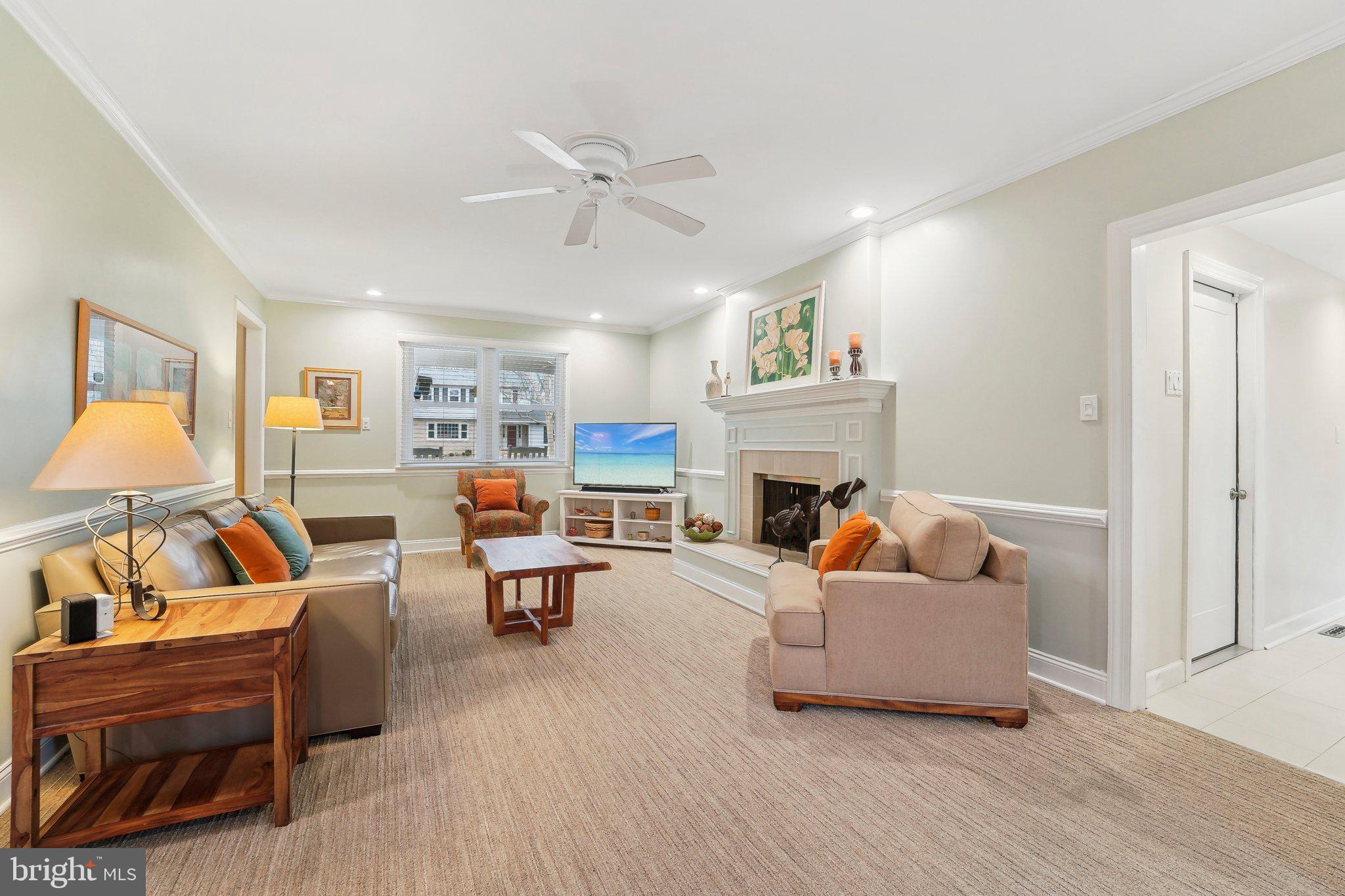 3 Emerson Road Severna Park, MD 21146 - Photo 13 of 65 a living room with furniture and a fireplace
