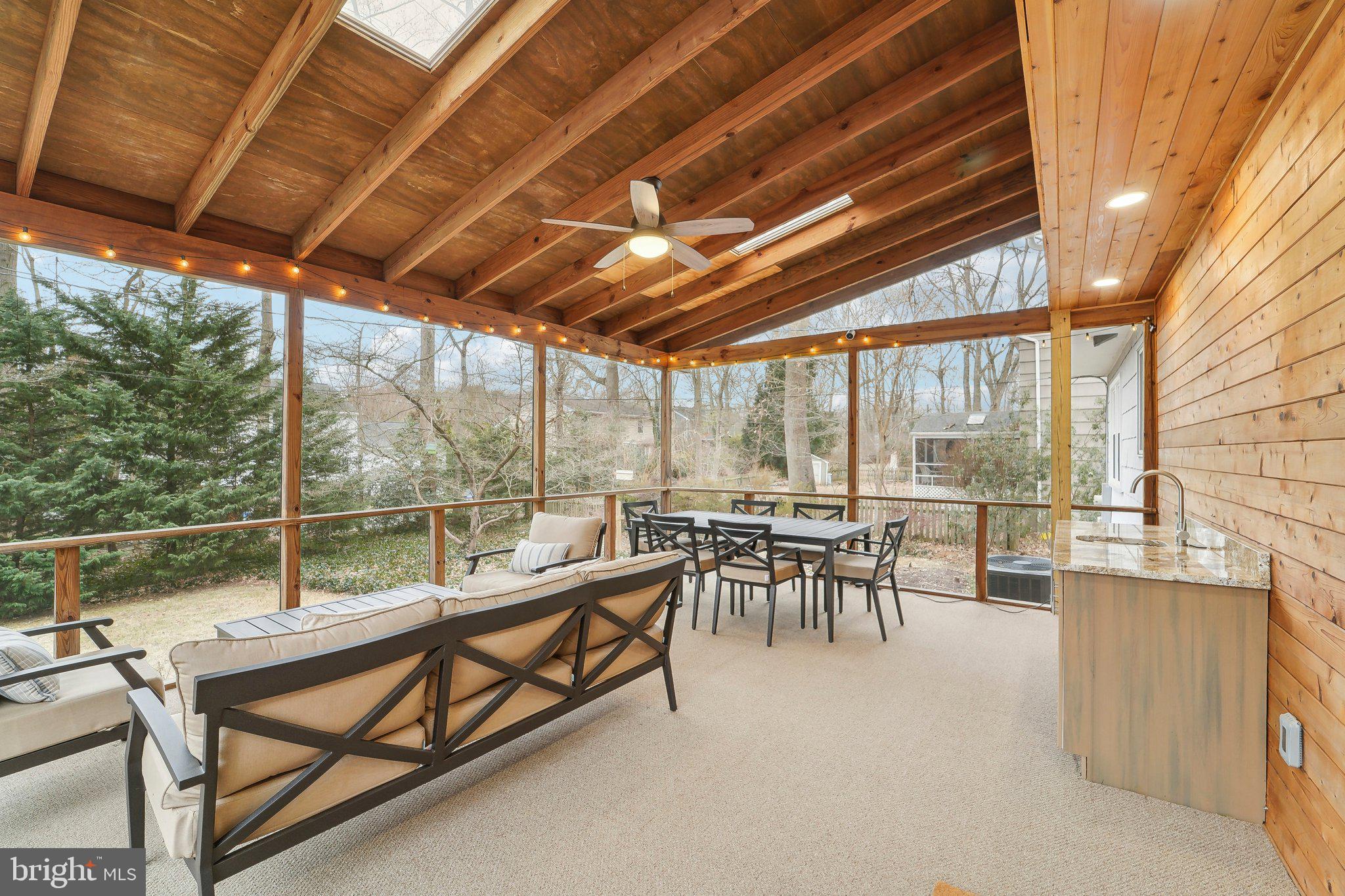 3 Emerson Road Severna Park, MD 21146 - Photo 15 of 65 a view of a patio with a table chairs and wooden fence