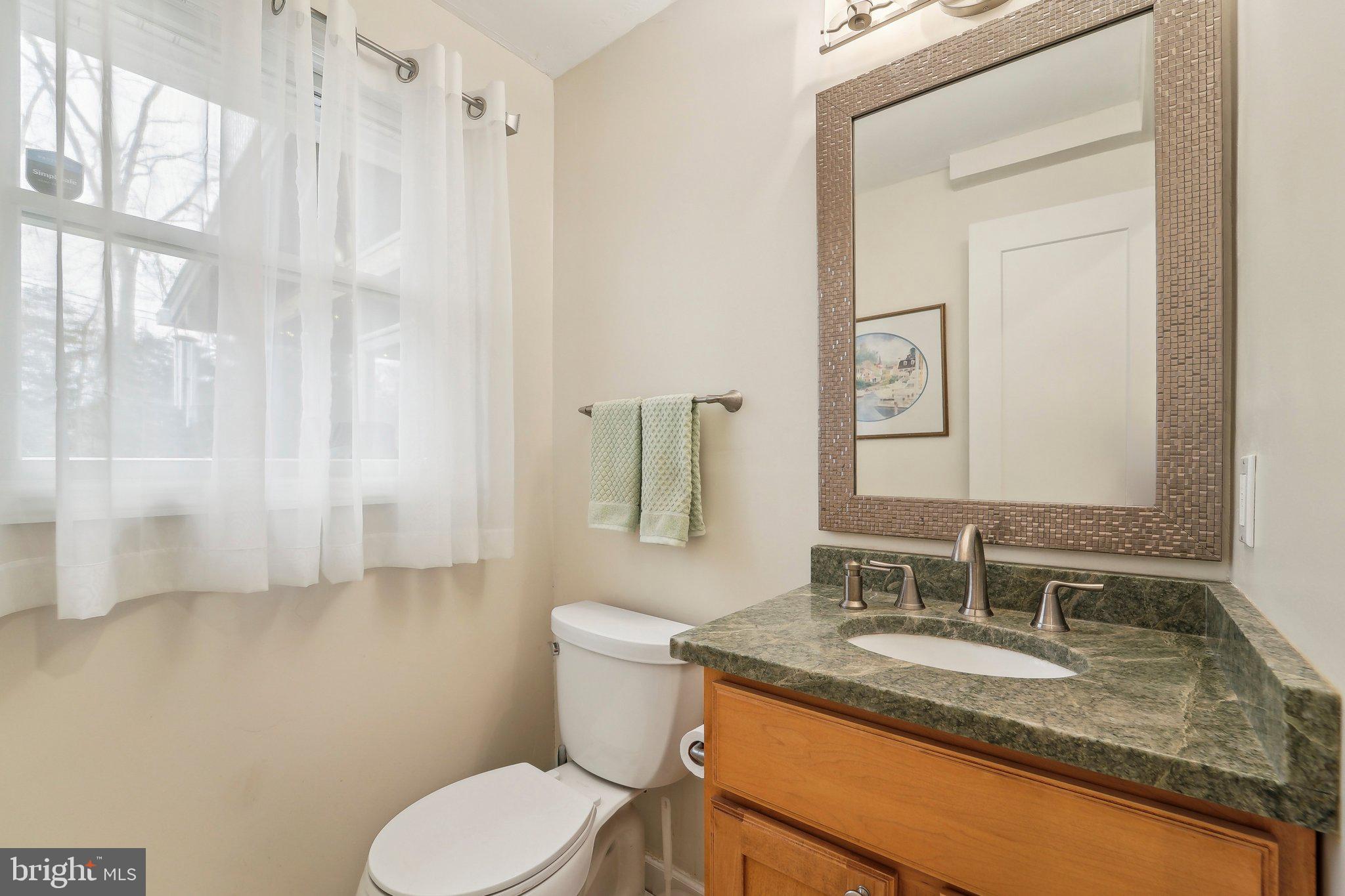 3 Emerson Road Severna Park, MD 21146 - Photo 16 of 65 a bathroom with a granite countertop sink toilet and mirror