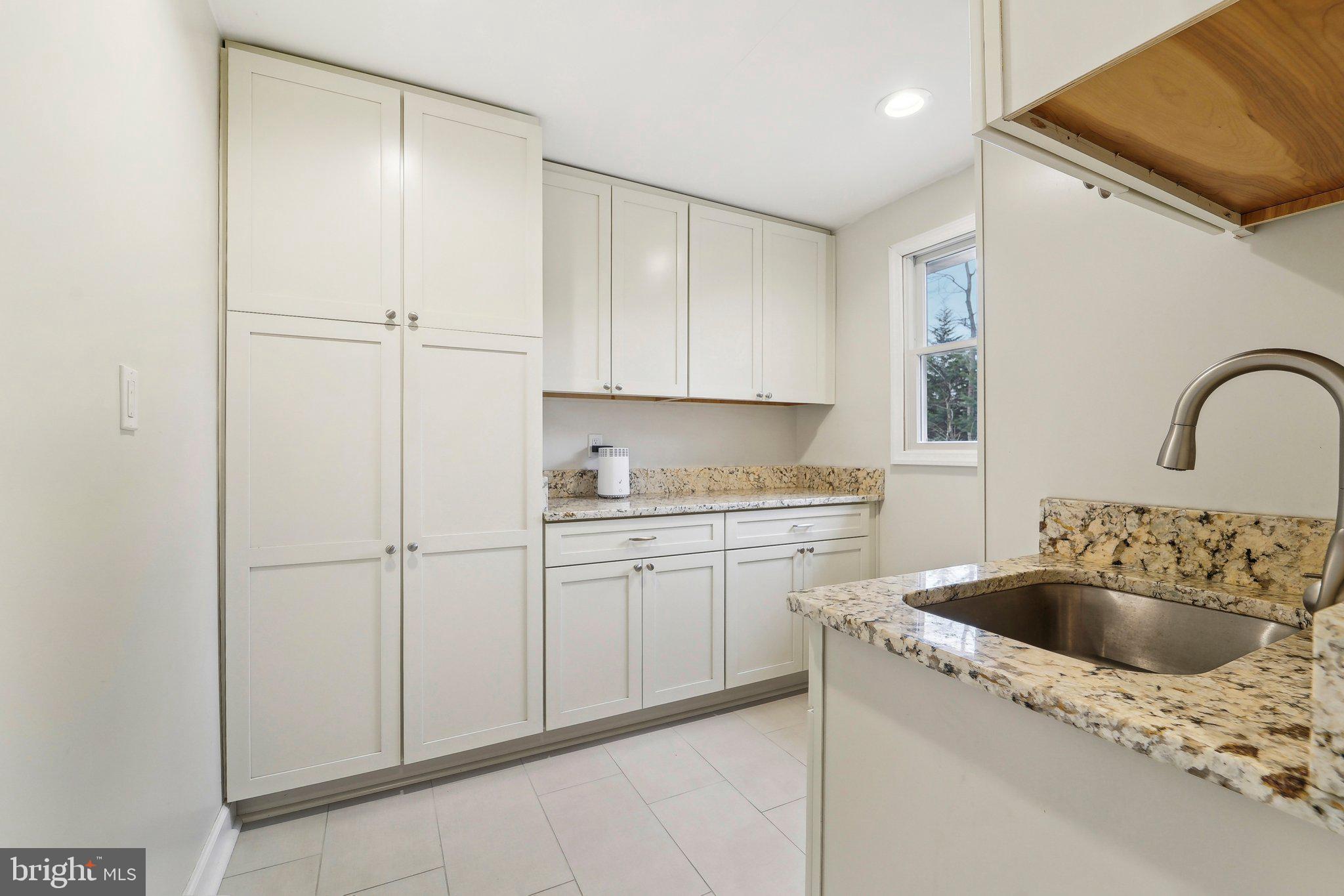 3 Emerson Road Severna Park, MD 21146 - Photo 17 of 65 a kitchen with a sink cabinets and washer