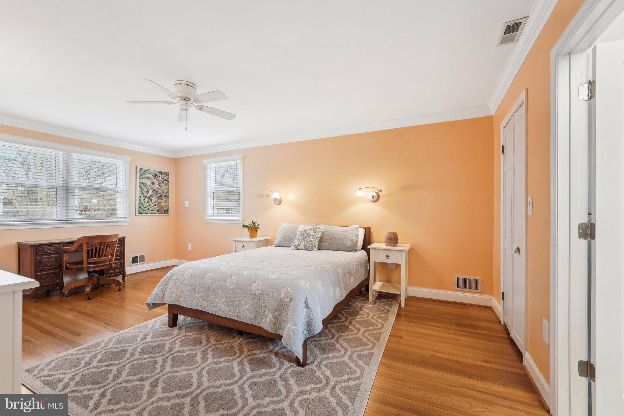 3 Emerson Road Severna Park, MD 21146 - Photo 21 of 65 a spacious bedroom with a bed and wooden floor