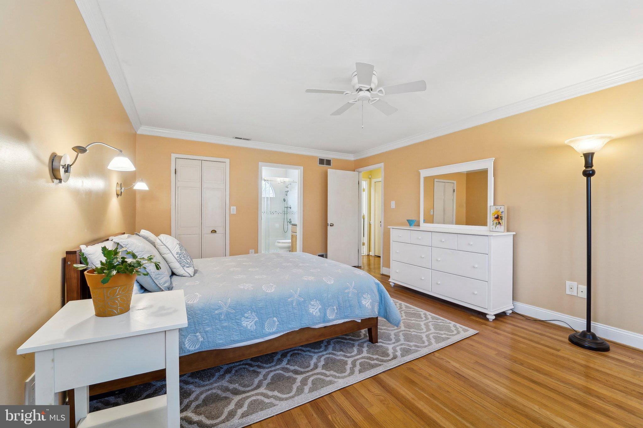 3 Emerson Road Severna Park, MD 21146 - Photo 22 of 65 a bedroom with a bed and wooden floor