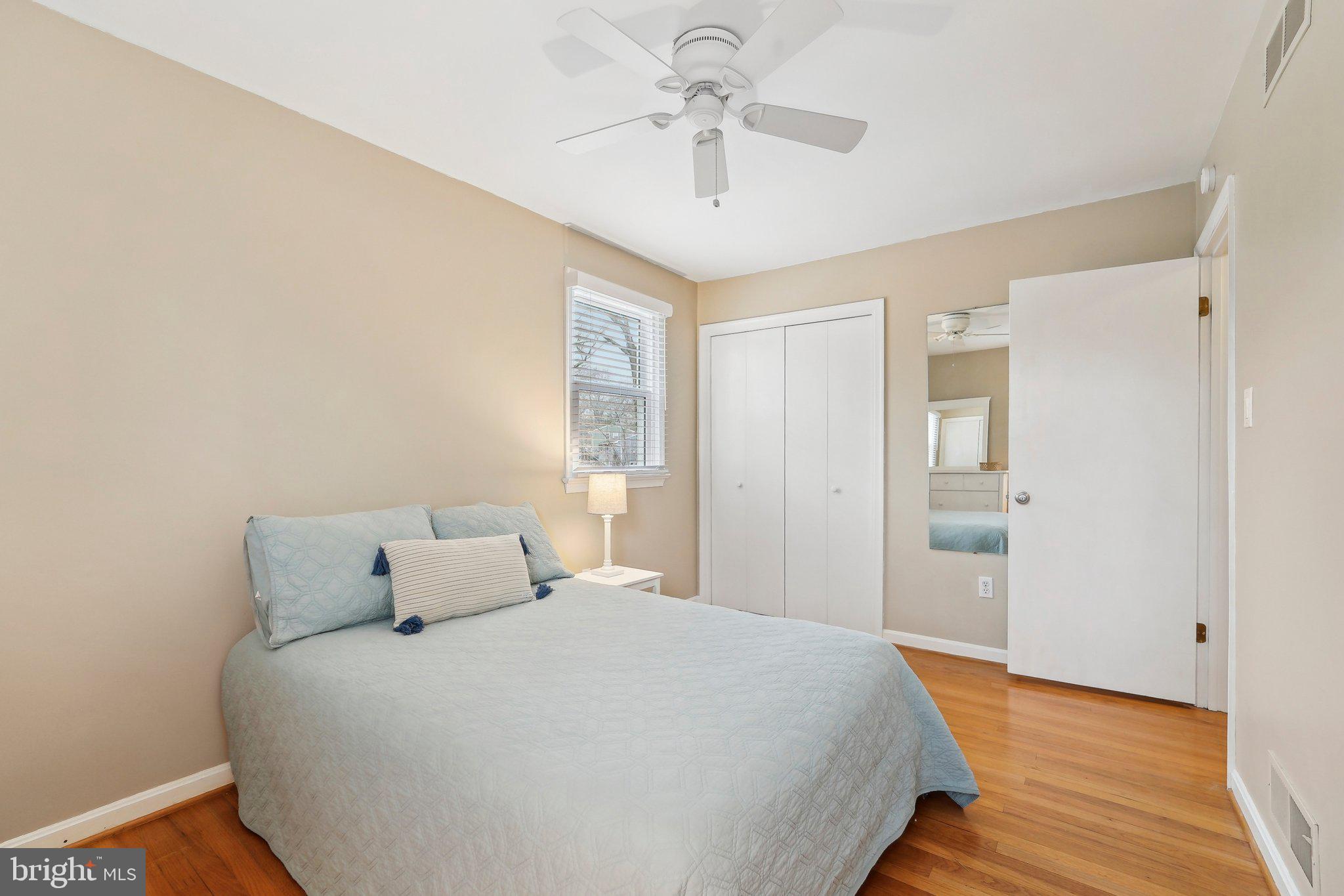 3 Emerson Road Severna Park, MD 21146 - Photo 28 of 65 a spacious bedroom with a bed and a chandelier