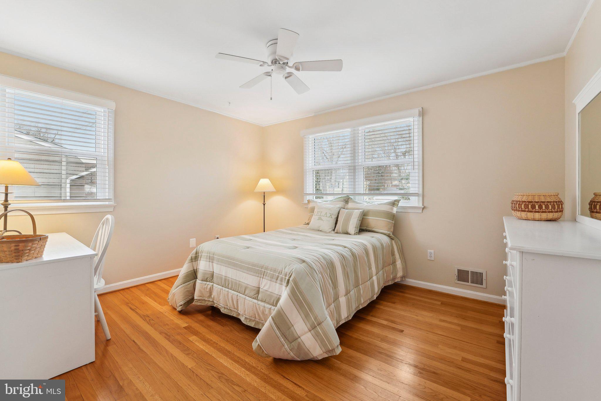 3 Emerson Road Severna Park, MD 21146 - Photo 29 of 65 a bedroom with a bed and wooden floor