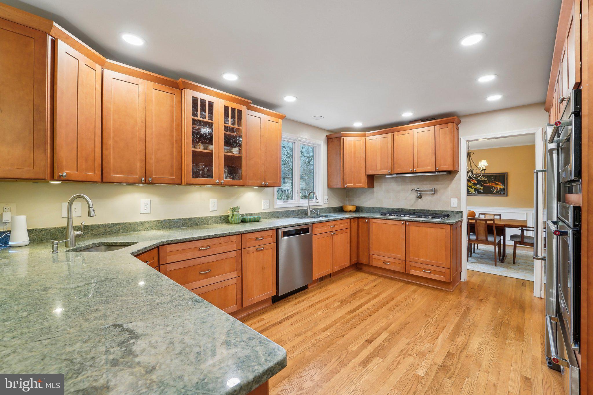 3 Emerson Road Severna Park, MD 21146 - Photo 4 of 65 a large kitchen with kitchen island granite countertop wooden cabinets a sink and dishwasher