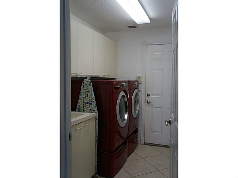 2212 Ridgewood Circle Royal Palm Beach, FL 33411 - Photo 26 of 34 Laundry Room.
