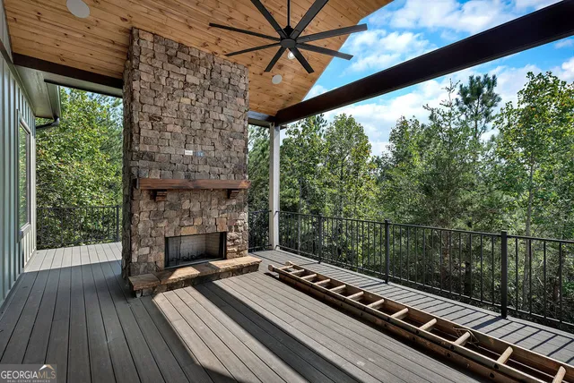 a view of balcony with furniture and garden