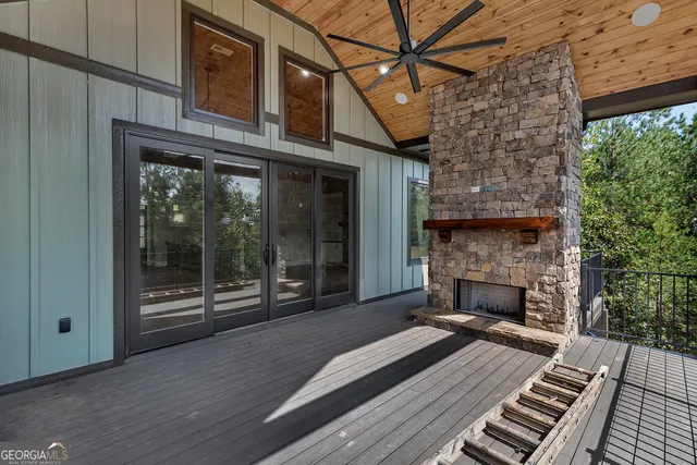 a view of a patio with a table and chairs