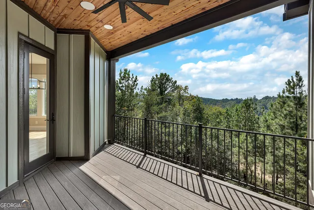 a view of a balcony with wooden floor