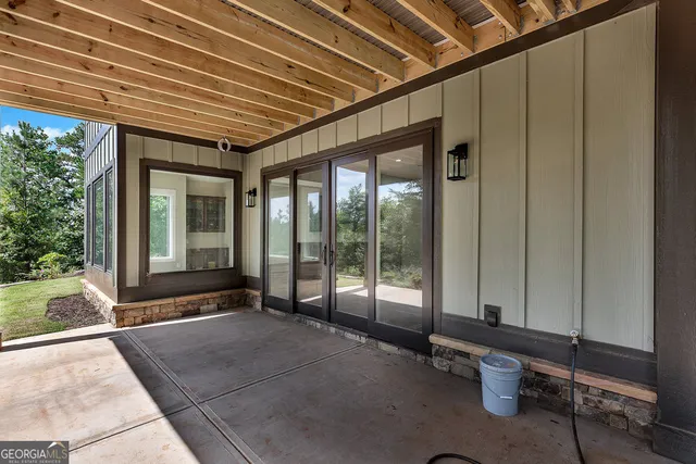 a view of a big yard with potted plants