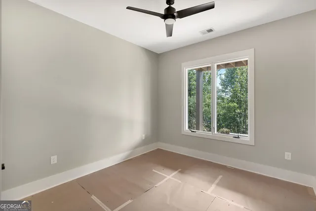 a bathroom with a double vanity sink mirror and shower