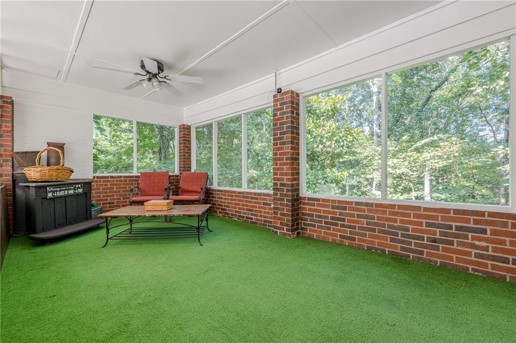 1874 Pinetree Trail Gainesville, GA 30501 - Photo 2 of 15 a living room with furniture and a yard