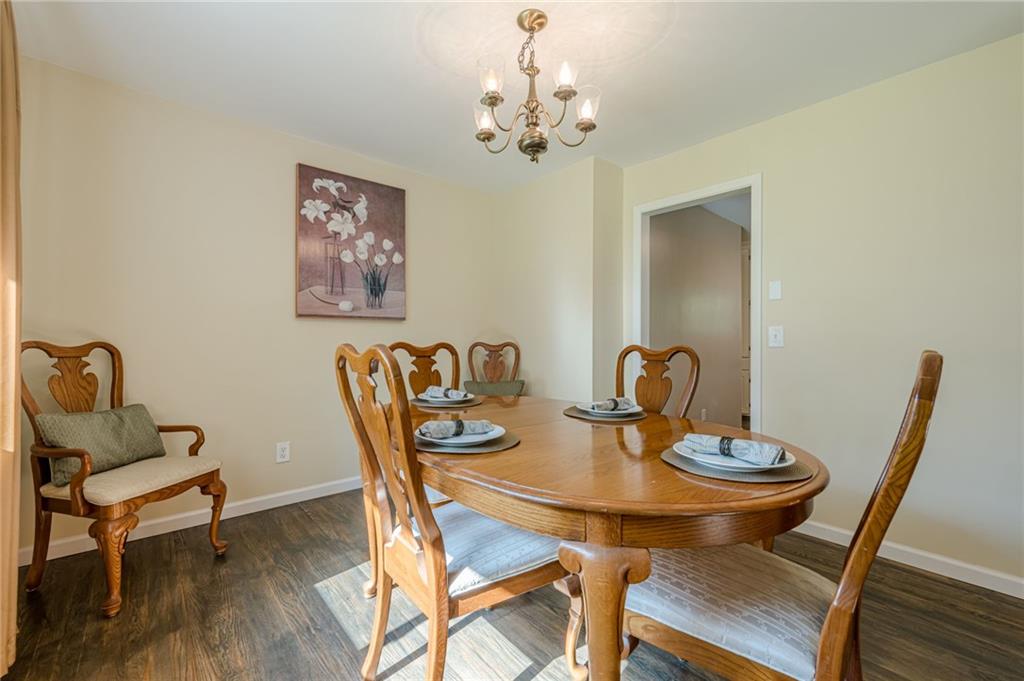 1874 Pinetree Trail Gainesville, GA 30501 - Photo 5 of 15 a view of a dining room with furniture and wooden floor