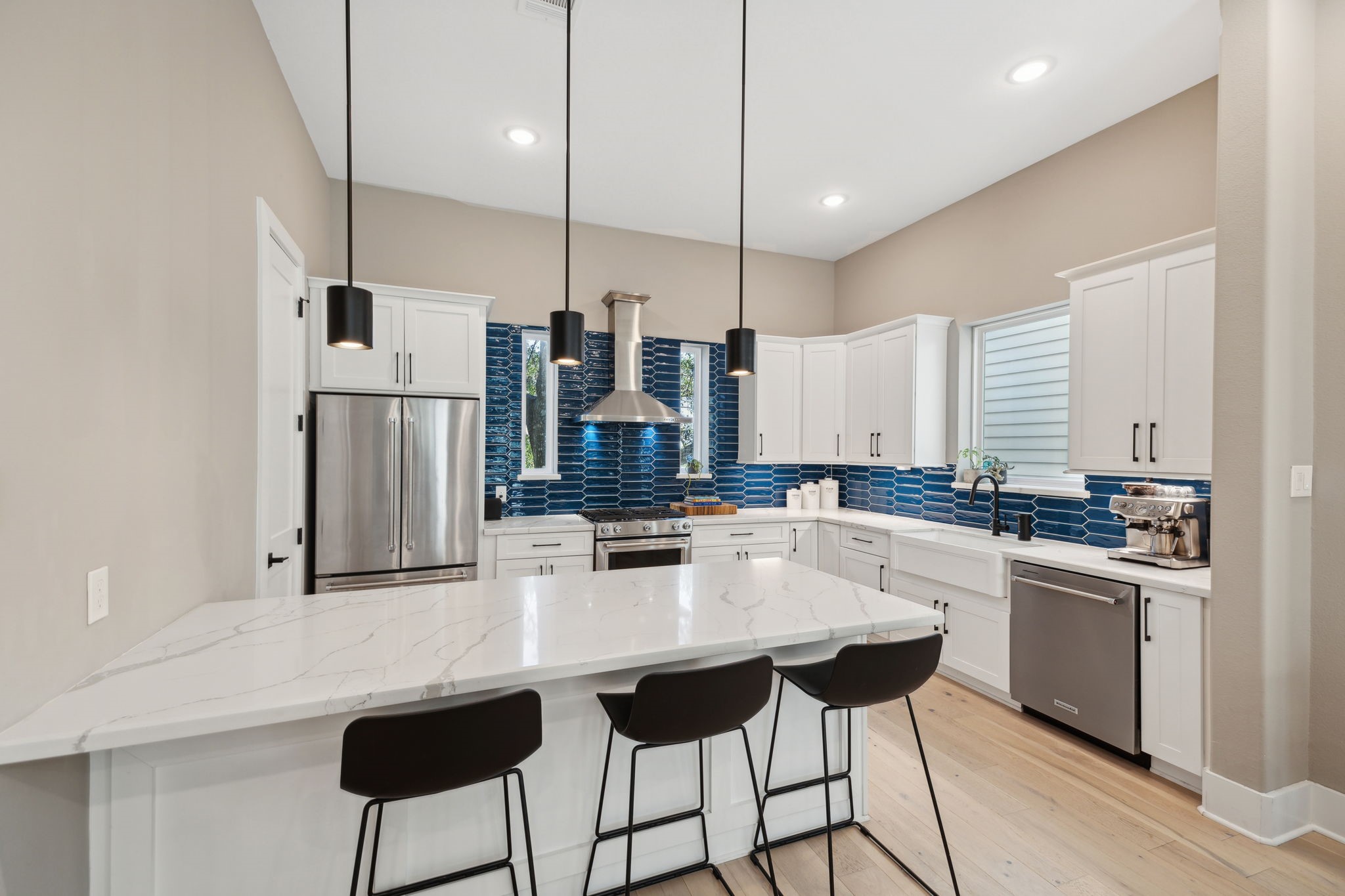 1413 West 23rd Street Houston, TX 77008 - Photo 17 of 39 a kitchen with stainless steel appliances kitchen island a refrigerator and a sink