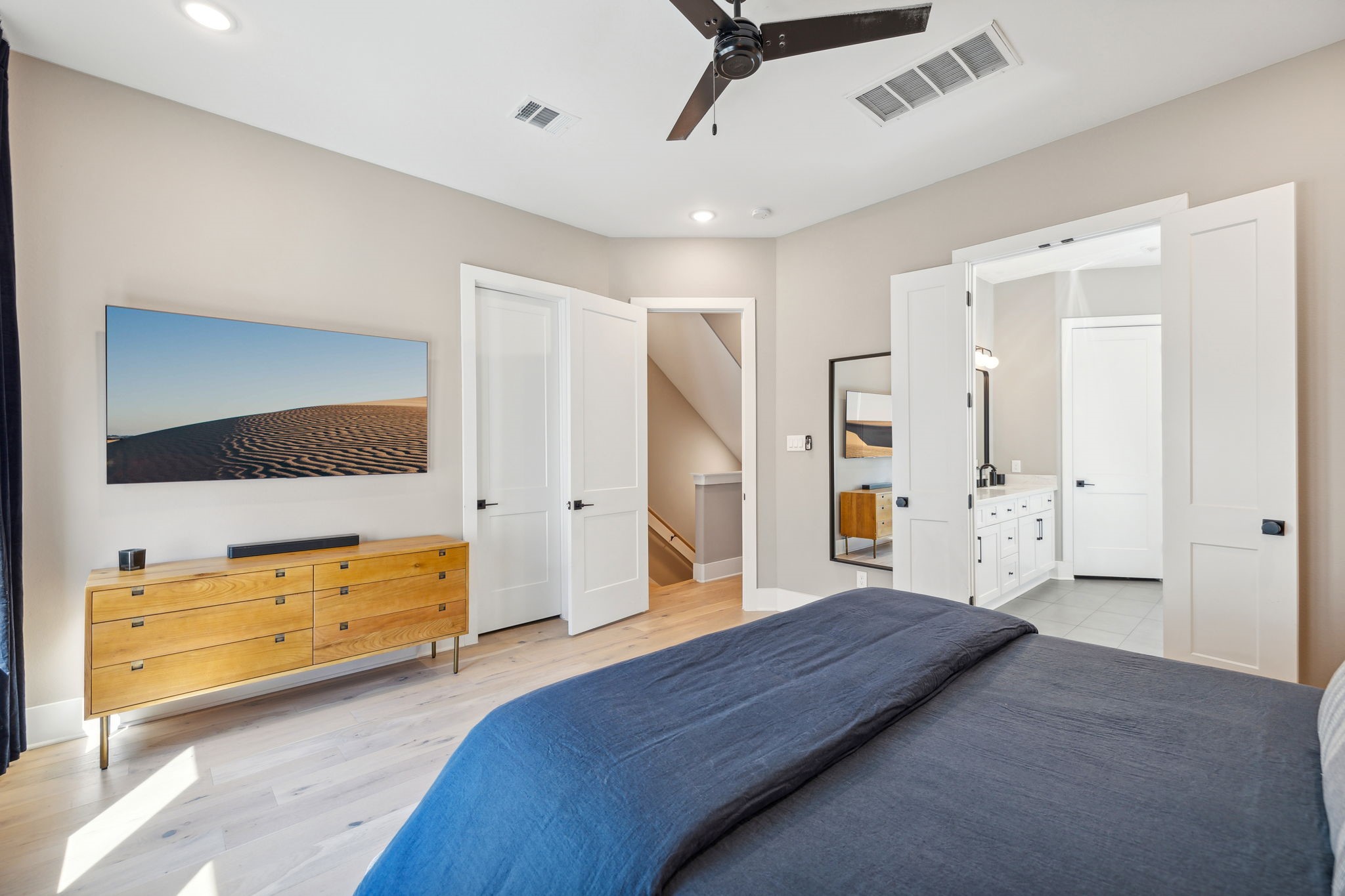1413 West 23rd Street Houston, TX 77008 - Photo 24 of 39 a spacious bedroom with a bed and a dresser