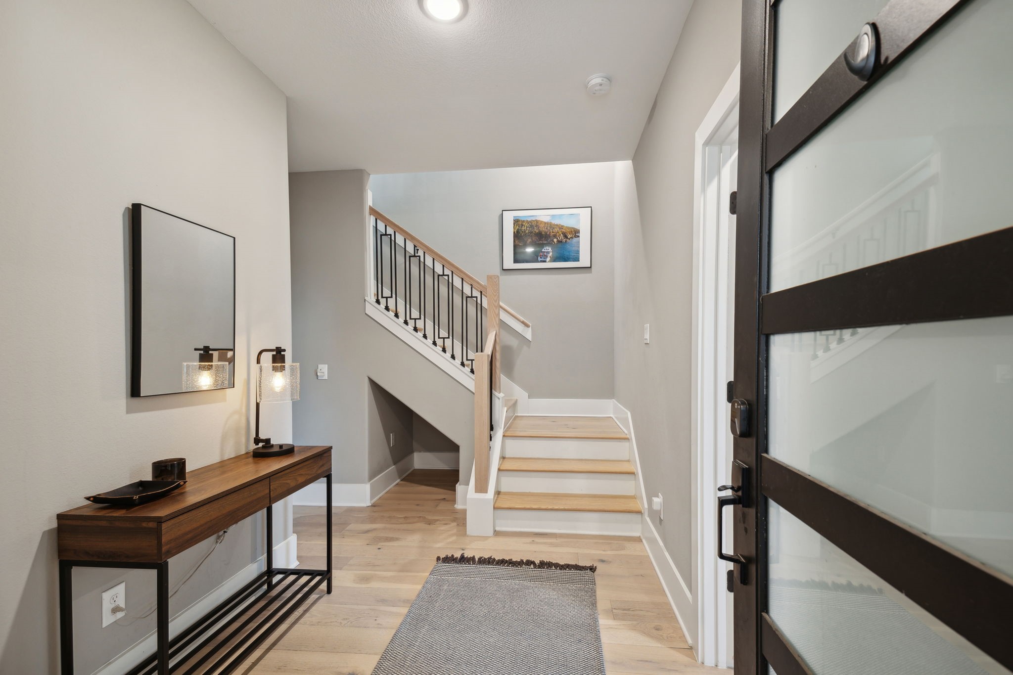 1413 West 23rd Street Houston, TX 77008 - Photo 5 of 39 a view of entryway and hall with wooden floor