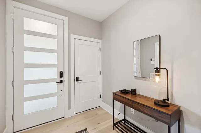 a room with a bench and a window