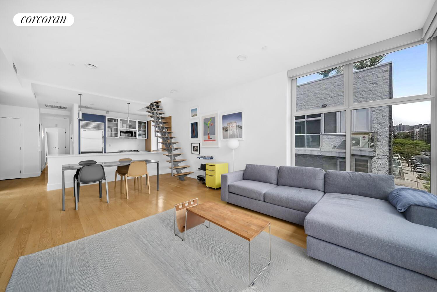 117 South 3rd Street, Unit 5A Brooklyn, NY 11249 - Photo 2 of 10 a living room with furniture and a table