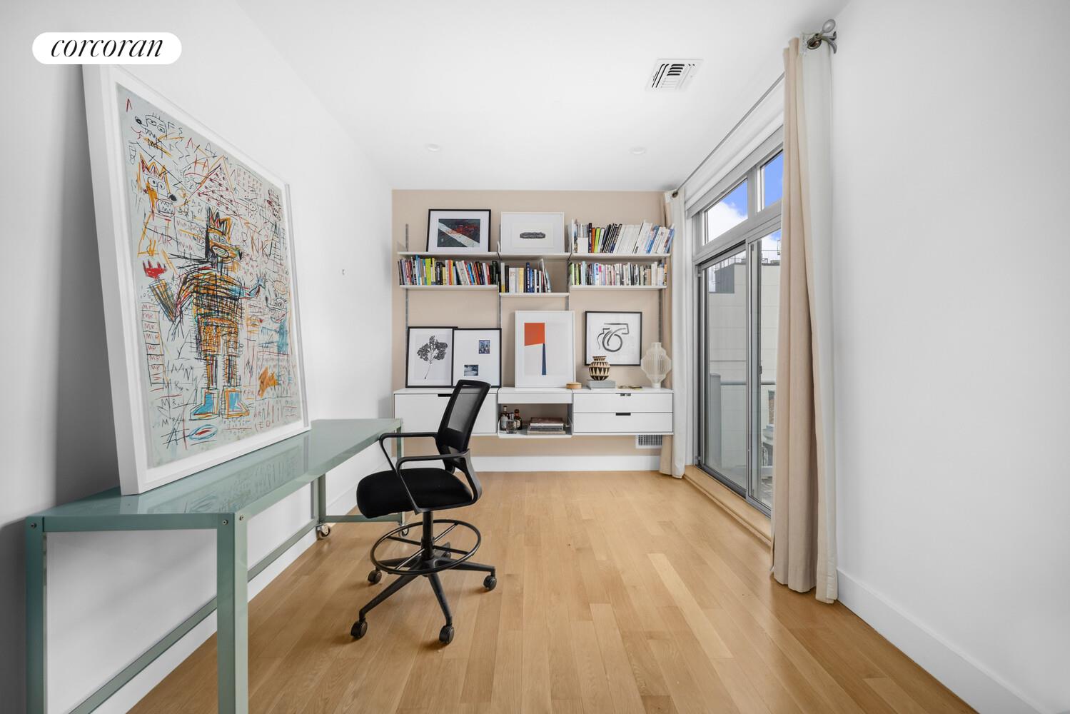 117 South 3rd Street, Unit 5A Brooklyn, NY 11249 - Photo 4 of 10 a view of a workspace with furniture and a window