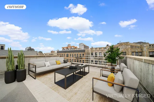 a view of a patio with dining table and chairs