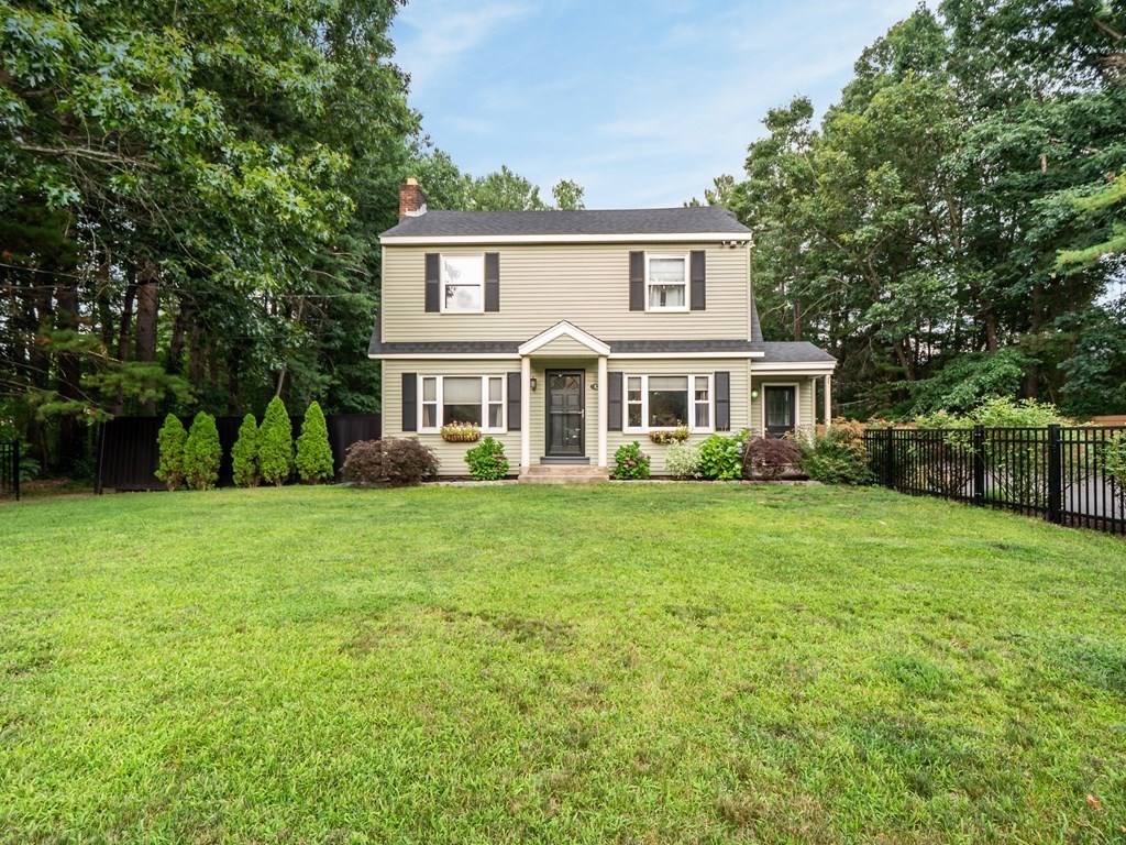 82 Rangeway Road Billerica, MA 01862 - Photo 1 of 40 a front view of a house with a yard and trees