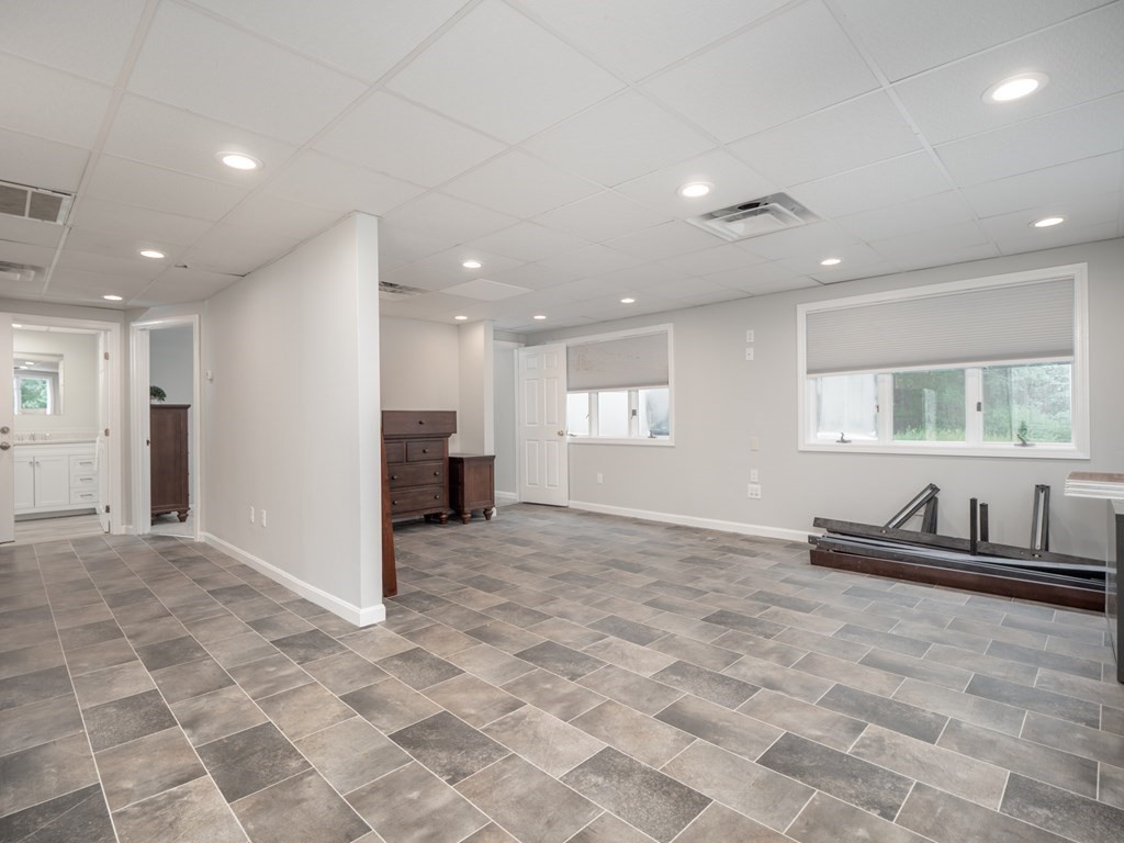 82 Rangeway Road Billerica, MA 01862 - Photo 19 of 40 a view of a big room with windows chandelier and a bath tub