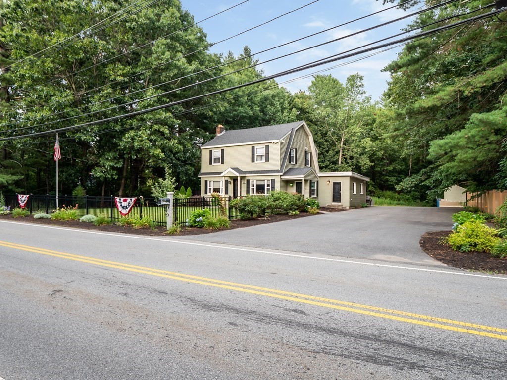 82 Rangeway Road Billerica, MA 01862 - Photo 2 of 40 a view of a house with a yard and large trees