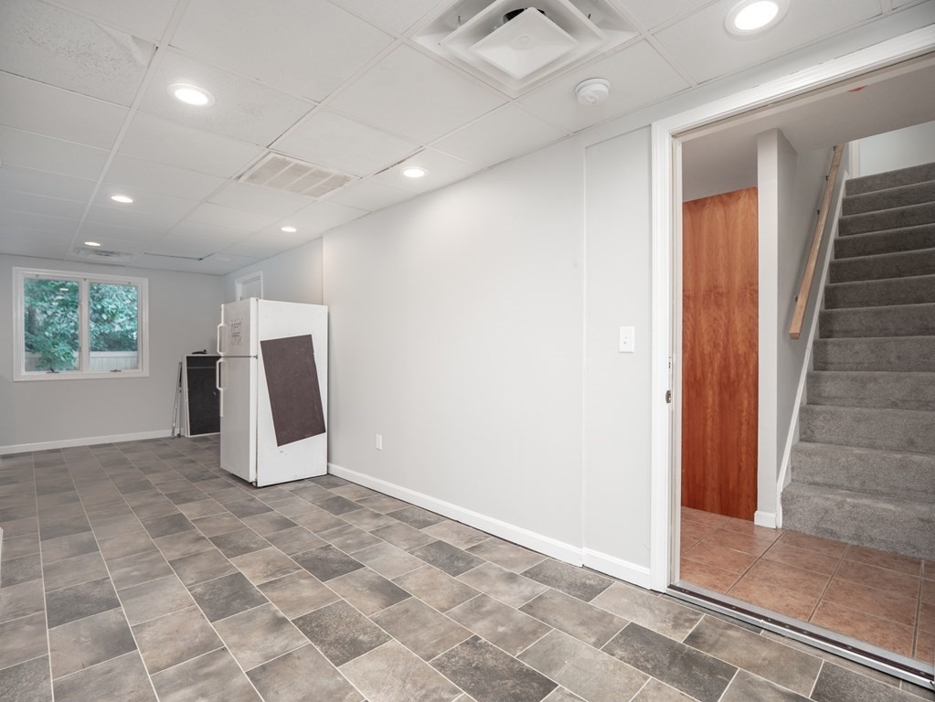 82 Rangeway Road Billerica, MA 01862 - Photo 24 of 40 a view of a livingroom with an empty space and a window