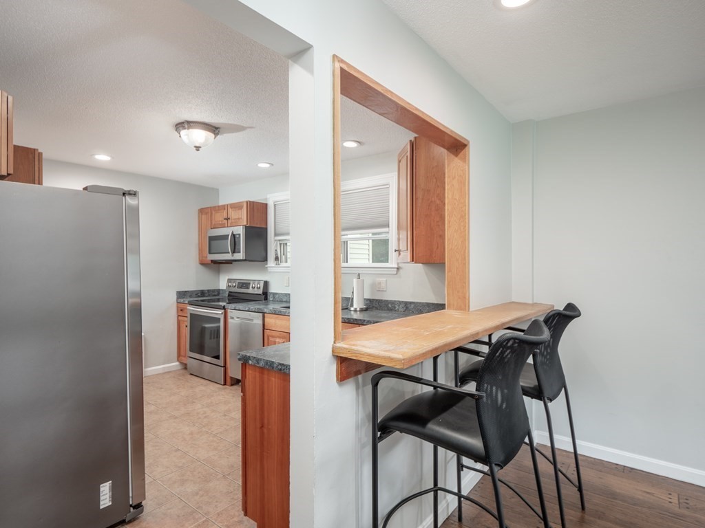 82 Rangeway Road Billerica, MA 01862 - Photo 29 of 40 a view of a dining room with furniture and a window