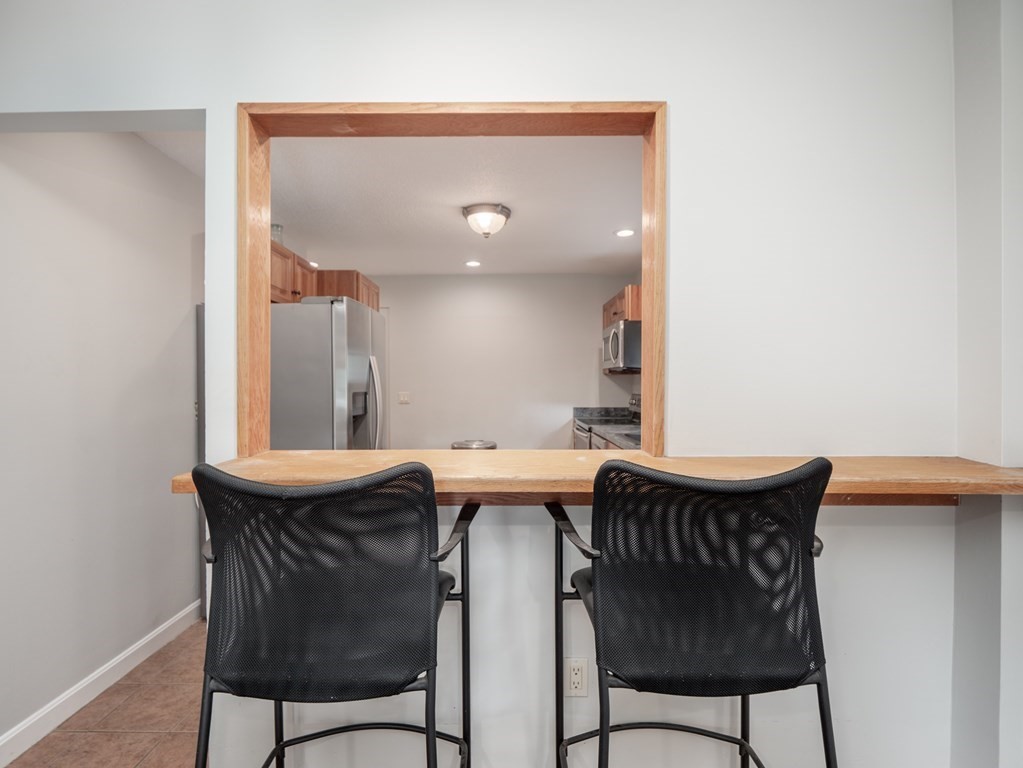 82 Rangeway Road Billerica, MA 01862 - Photo 30 of 40 a view of a dining room with furniture and wooden floor