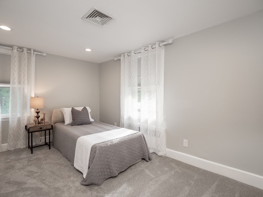 82 Rangeway Road Billerica, MA 01862 - Photo 7 of 40 a bedroom with a bed and a window