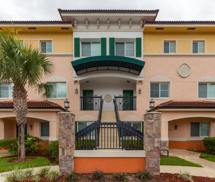 9745 Touchton Road, Unit 2028 Jacksonville, FL 32246 - Photo 1 of 20 a front view of a house with a yard
