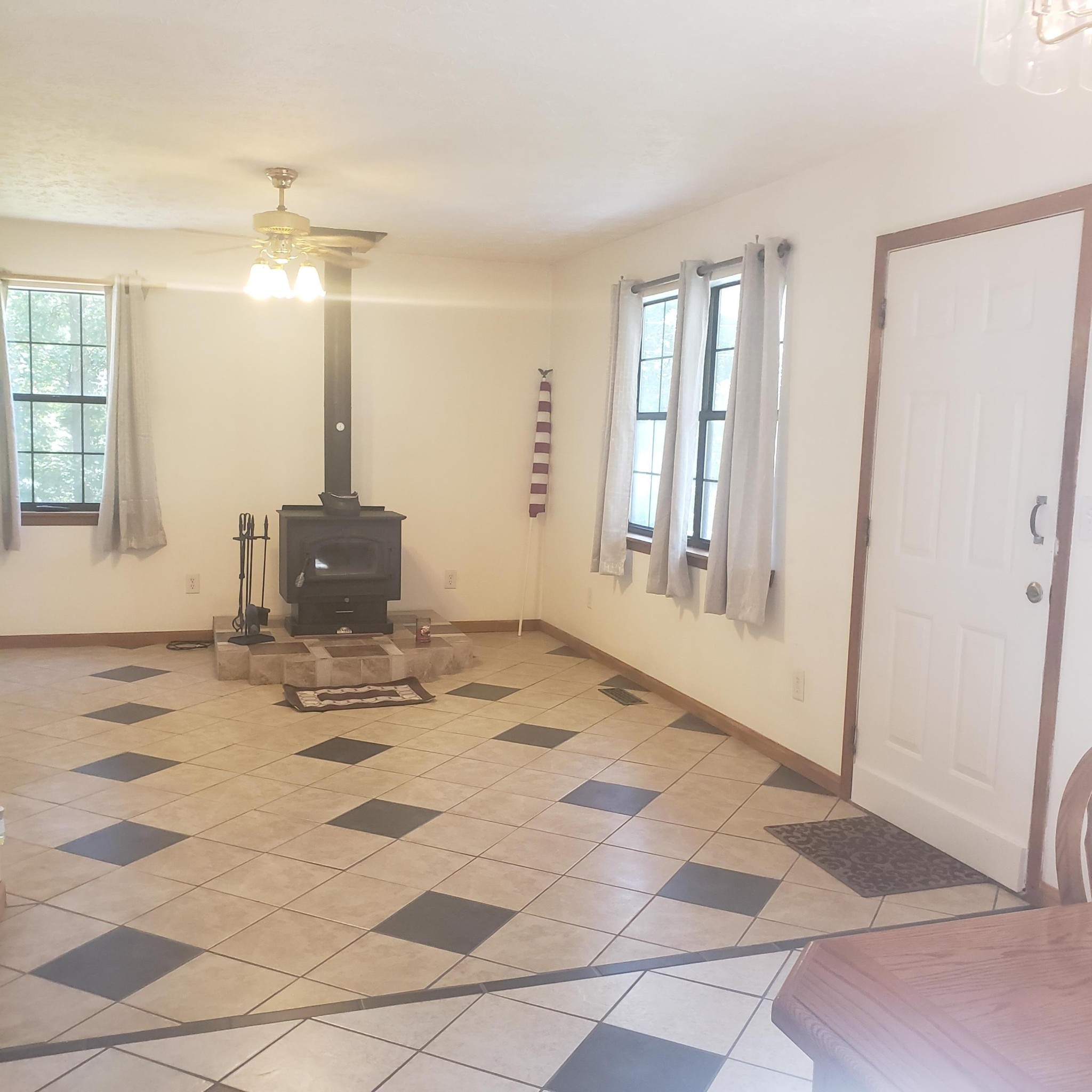 181 Nydeck Road Robbins, TN 37852 - Photo 7 of 19 a view of a livingroom with wooden floor and a kitchen space