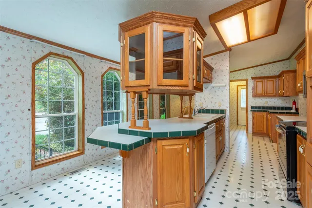 a view of a kitchen with a large window