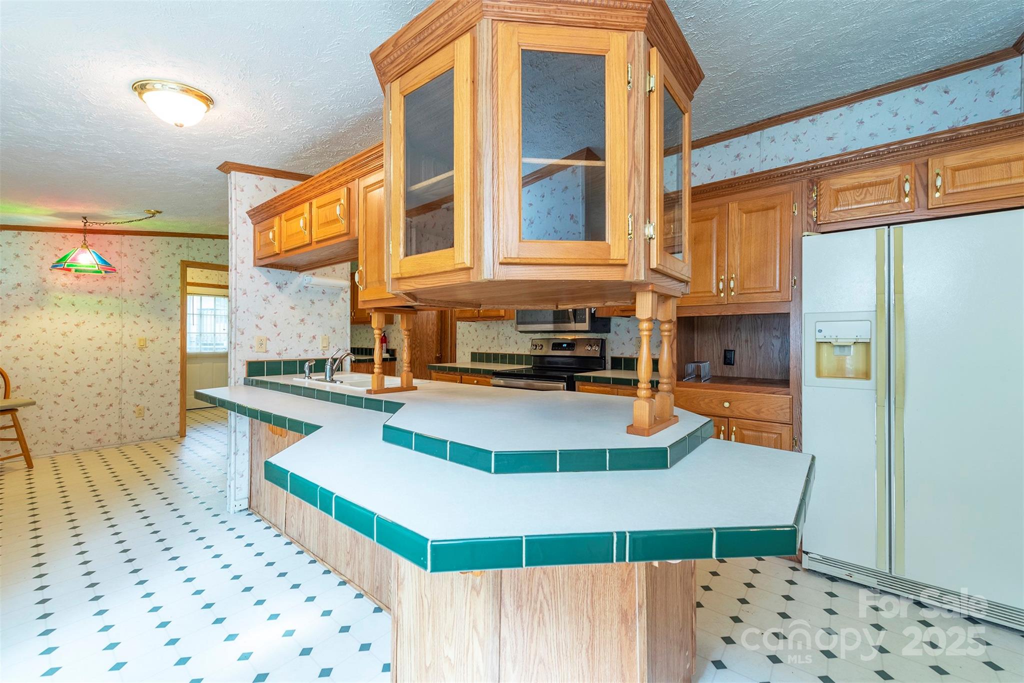 103 Sixth Street, Unit ~7&9 Black Mountain, NC 28711 - Photo 15 of 37 a view of a kitchen with a large window