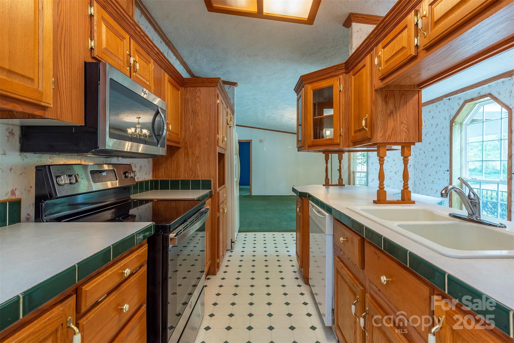 103 Sixth Street, Unit ~7&9 Black Mountain, NC 28711 - Photo 16 of 37 a kitchen with stainless steel appliances granite countertop a sink and a stove