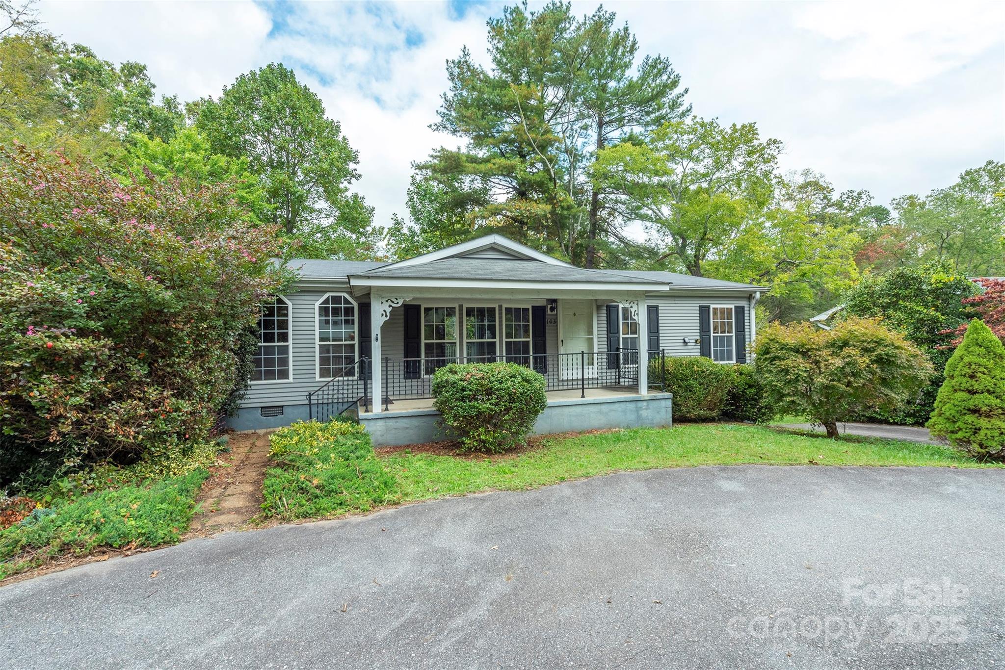 103 Sixth Street, Unit ~7&9 Black Mountain, NC 28711 - Photo 2 of 37 a front view of a house with a garden and yard