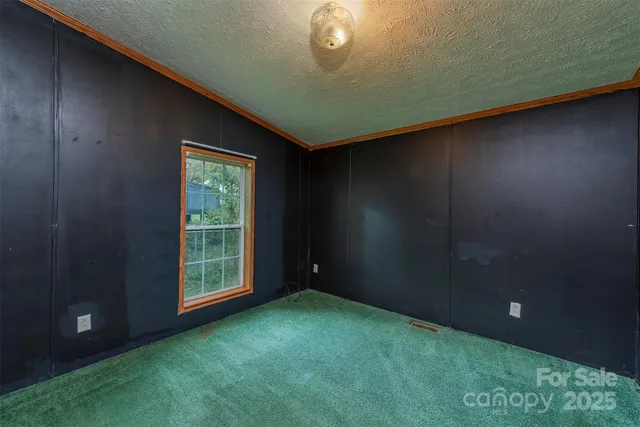 a view of an empty room and closet area