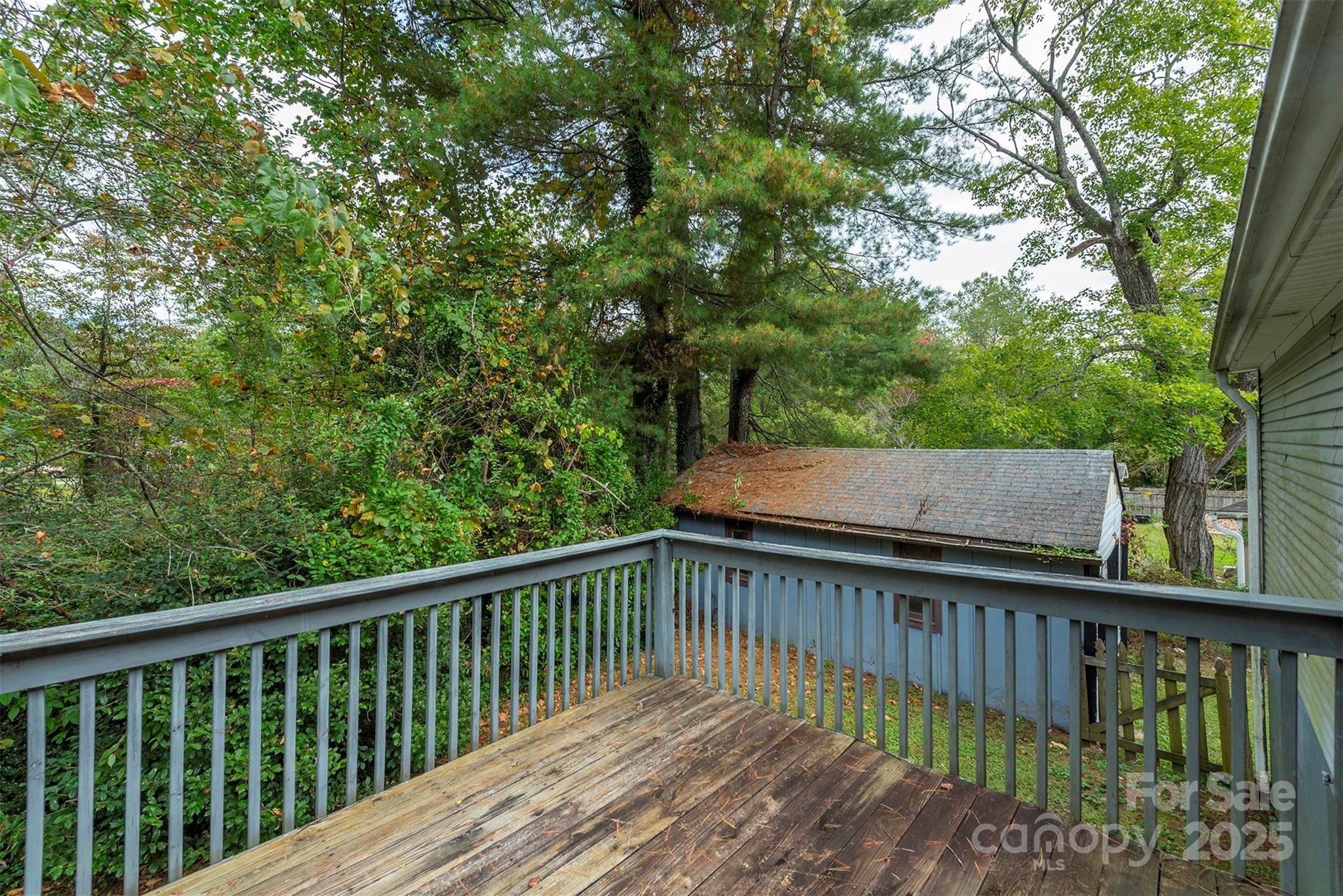 103 Sixth Street, Unit ~7&9 Black Mountain, NC 28711 - Photo 33 of 37 a balcony with wooden floor and fence
