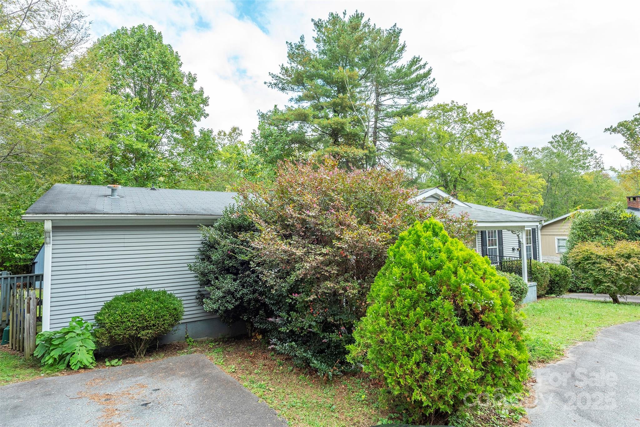 103 Sixth Street, Unit ~7&9 Black Mountain, NC 28711 - Photo 4 of 37 a front view of a house with garden