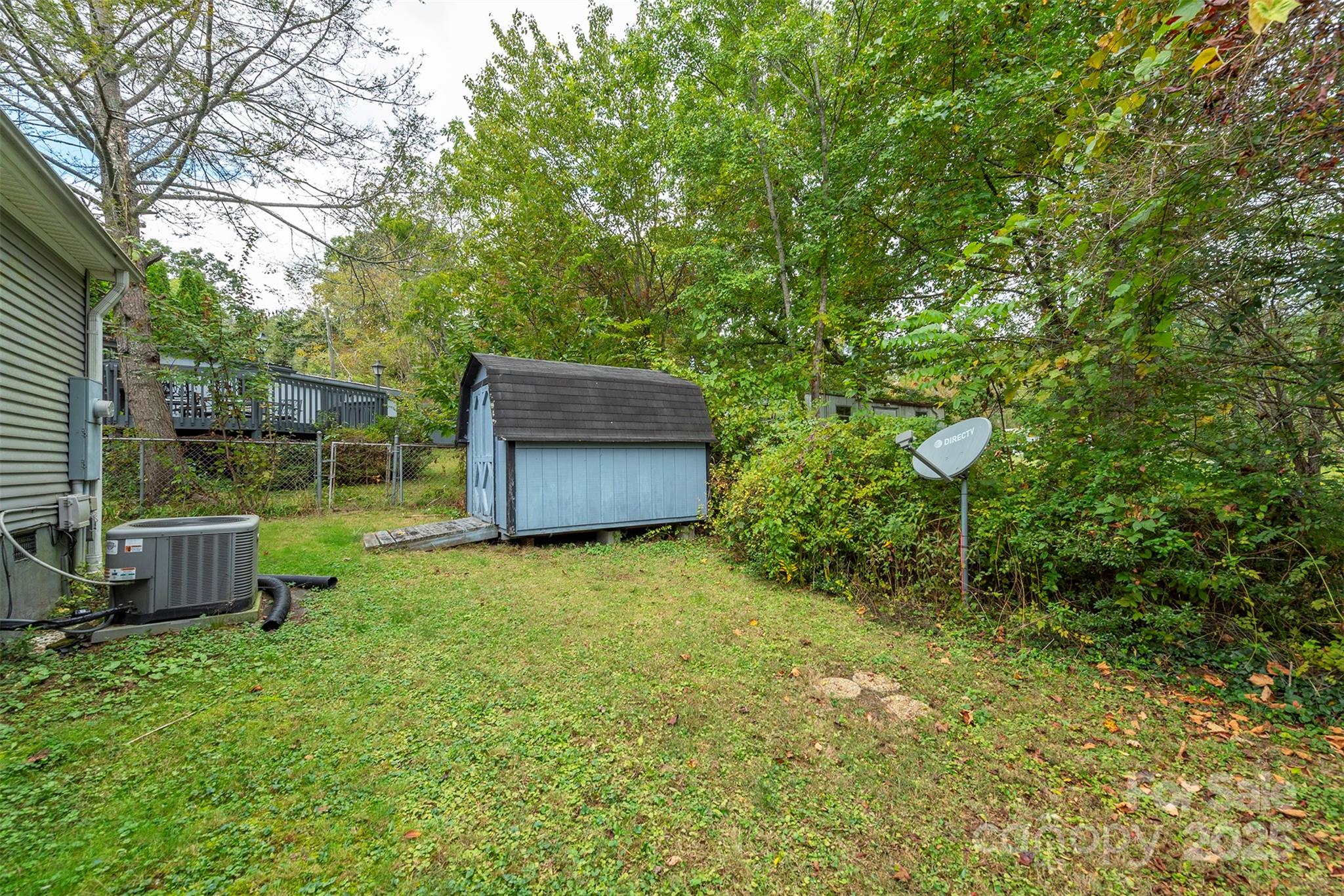 103 Sixth Street, Unit ~7&9 Black Mountain, NC 28711 - Photo 5 of 37 a backyard of a house with lots of green space