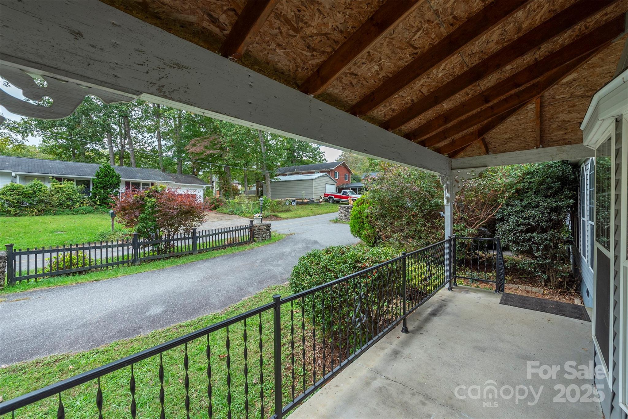 103 Sixth Street, Unit ~7&9 Black Mountain, NC 28711 - Photo 6 of 37 a view of a porch and garden