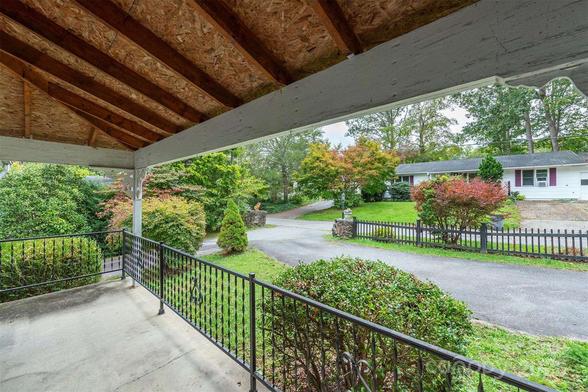 103 Sixth Street, Unit ~7&9 Black Mountain, NC 28711 - Photo 7 of 37 a view of a garden from deck