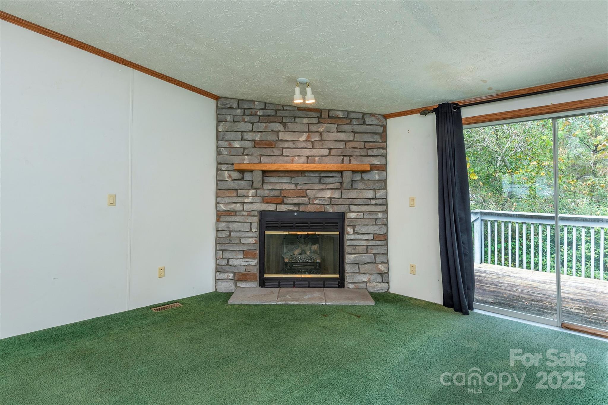 103 Sixth Street, Unit ~7&9 Black Mountain, NC 28711 - Photo 10 of 37 a living room with a fireplace and a large window