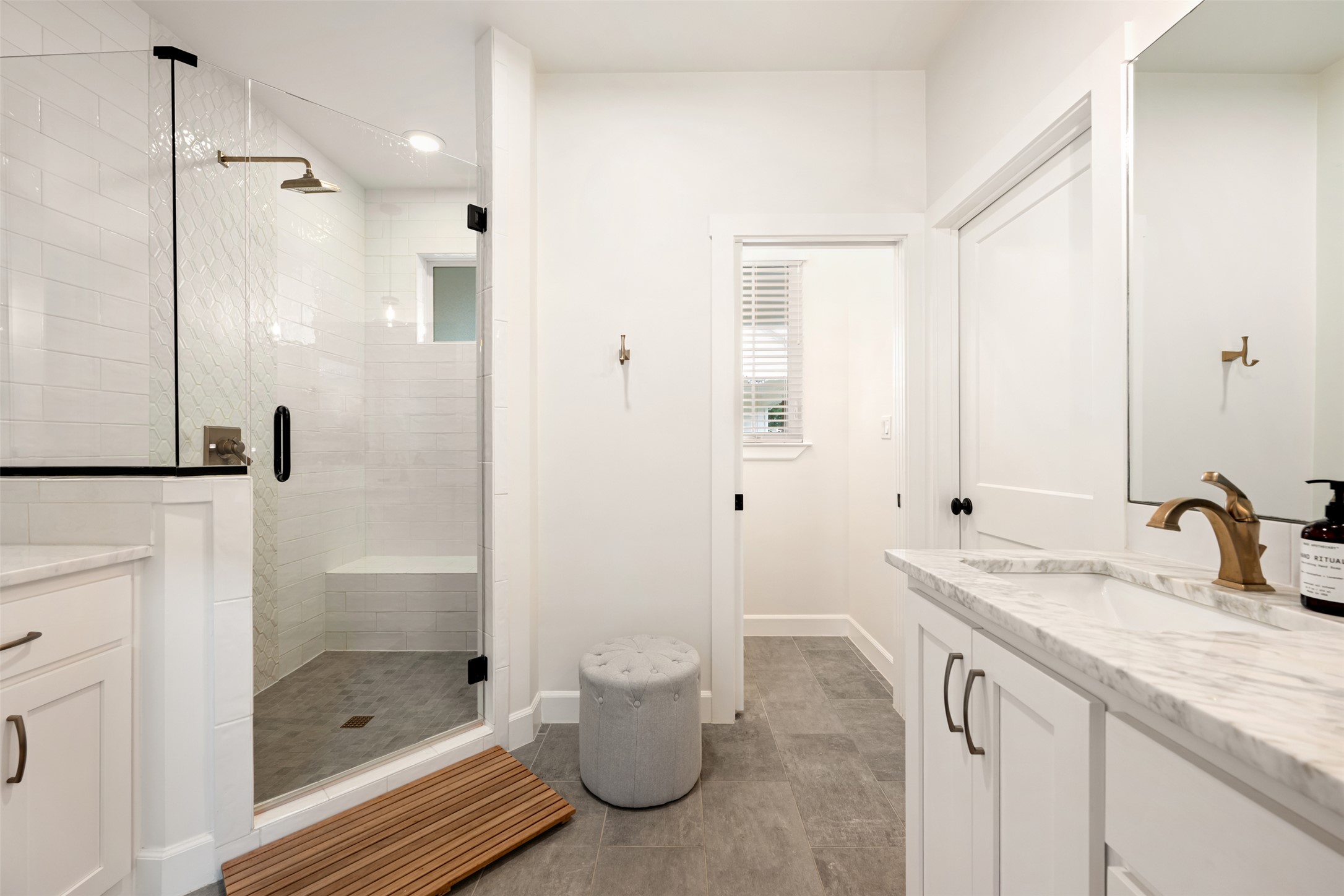 1301 West Street Georgetown, TX 78626 - Photo 22 of 40 Luxurious walk-in shower and dual vanities provide a private oasis for rejuvenation.